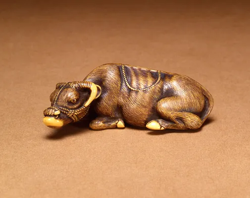 Netsuke of a reclining cow