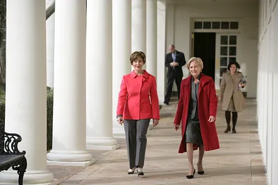 Mrs. Laura Bush Walks with Alma Adamkus, the First Lady of Lithuania, Along the Colonnade in the Rose Garden During a Visit to the White House