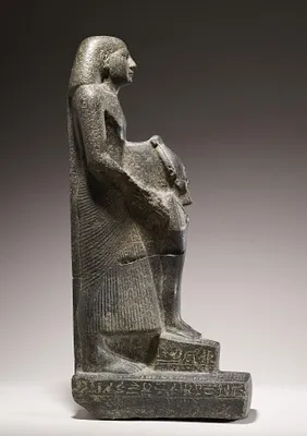 Priest Holding the Figure of Osiris