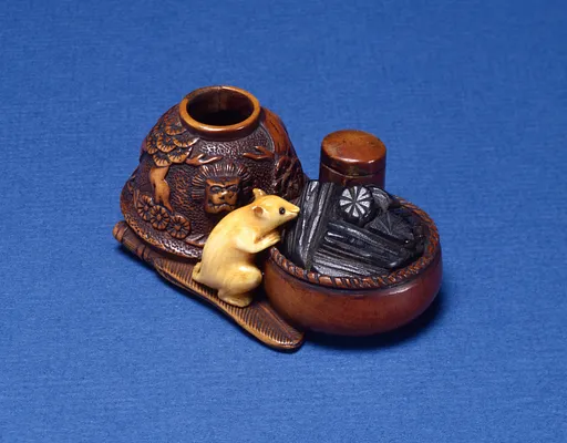 Netsuke depicting a rat investigating tea ceremony objects
