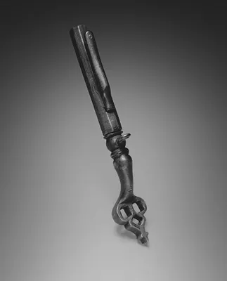 Combined Wheel-Lock Spanner and Powder Measure