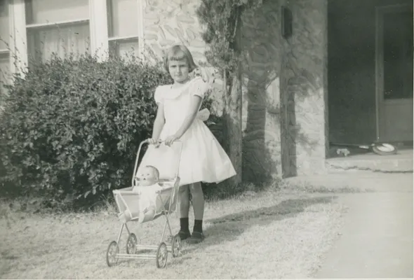 Young Girl with Doll Stroller, 1955