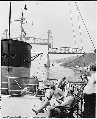Photograph of President Truman, his friend Theodore Marks, and Treasury Secretary John Snyder enjoying a sun bath on the flying bridge of the President's yacht, the U.S.S. WILLIAMSBURG, during his vacation cruise to Bermuda
