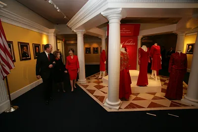 Duke Blackwood, Director of the Ronald Reagan Presidential Library and Museum, Guides Mrs. Laura Bush and Mrs. Nancy Reagan on a Tour of the Red Dress Exhibit