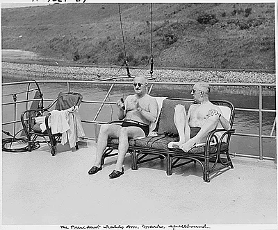 Photograph of President Truman and his friend, Theodore Marks, enjoying the sun on the flying bridge of the President's yacht, the U.S.S. WILLIAMSBURG, during his vacation cruise to Rhode Island and Bermuda
