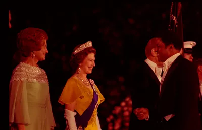 First Lady Betty Ford and Queen Elizabeth II of Great Britain Greeting Baseball Player Willie Mays in the Receiving Line on the South Driveway of the White House Prior to a State Dinner Honoring Her Majesty and Prince Philip