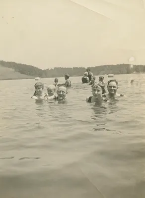 Bill and Verna Schnell with friends swimming in a lake during a holiday, 1924