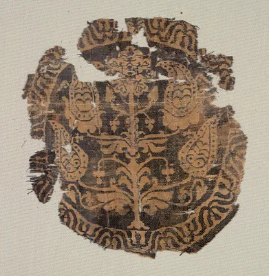 Roundel with curvilinear palmette tree, from a tunic