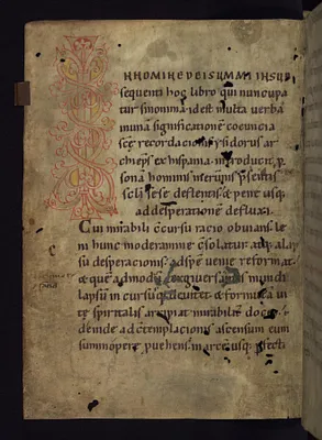 Inhabited initial ""I"" with beast heads