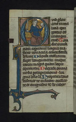 Initial Q with a seated king holding a sword and orb