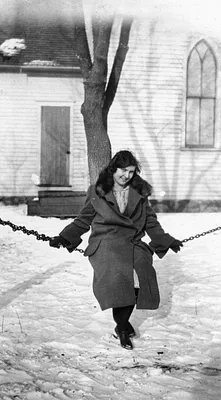 Woman on Swing in Snowy Setting, Cedar Falls, 1924