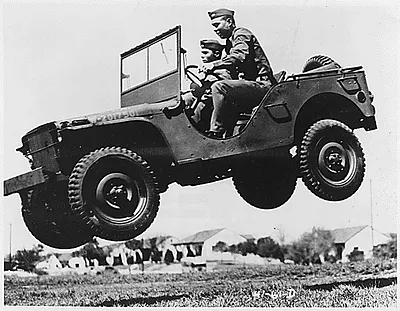 These soldiers go up in the air to prove that the Army's new quarter ton truck can take it.