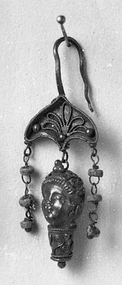 Earring with a woman's head