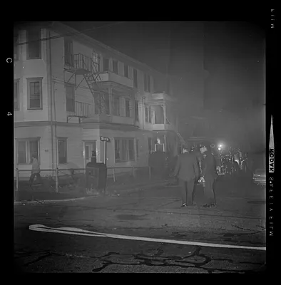 Officers standing in a street filled with smoke