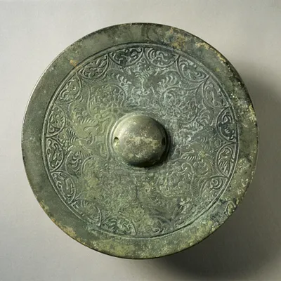 Mirror with Quatrefoil, Paired Phoenixes, and Auspicious Animals