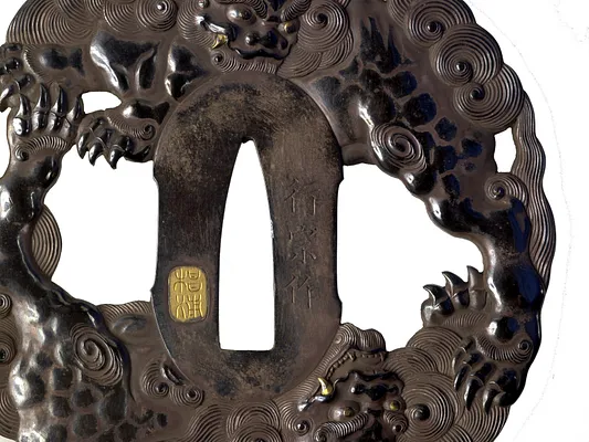 Tsuba with Chinese Lions Among Clouds