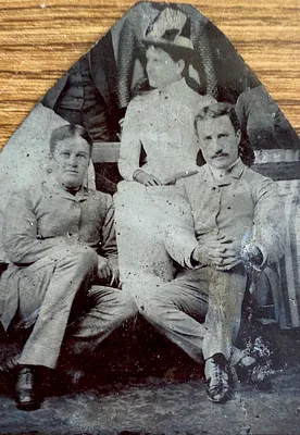 Three unidentified people sitting