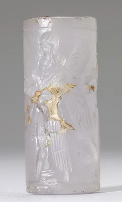 Cylinder Seal with a Winged Genius and Human-Headed Lions