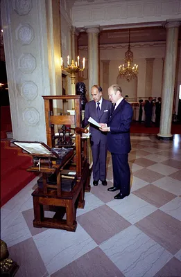 President Gerald R. Ford and French President Valery Giscard d'Estaing Examining an Antique Printing Press Presented as a Bicentennial Gift to the United States on Behalf of the People of France