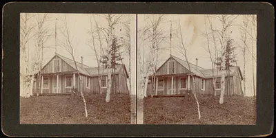 Wooden cabin with flag pole