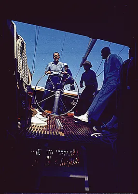 President Richard Nixon at the Wheel of the "Columbia" near Newport Island, California