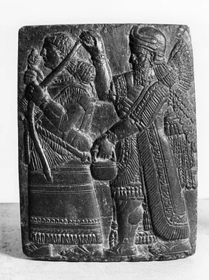 Plaque with a King (?) and Winged Genius