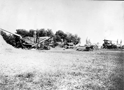 Mr. Hall and threshing machine