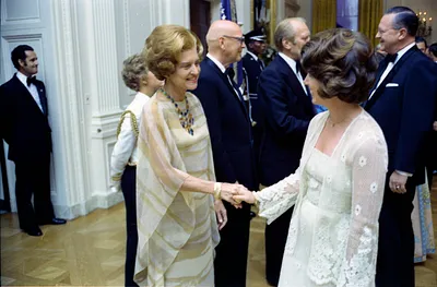 First Lady Betty Ford Shaking Hands with an Unidentified Woman in the Receiving Line at a State Dinner Honoring President Kekkonen of Finland