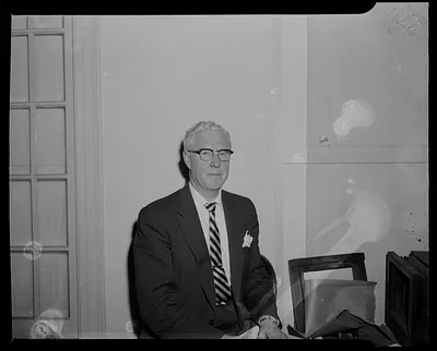 Man with glasses, seated