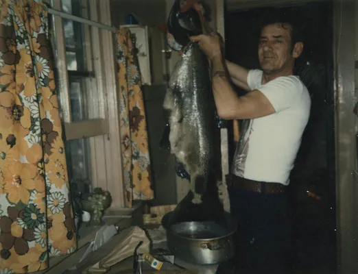 Al “Smitty” Holding up his catch of the day, 1975