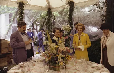 First Lady Betty Ford and Social Secretary Maria Downs Conducting a Media Press Tour of the Tent on the South Lawn of the White House While White House Staff Prepare for a State Dinner Honoring Queen Elizabeth II and Prince Philip of Great Britain