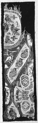 Fragment of a rug ? Roundels with birds and heads