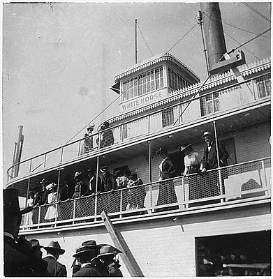 Group of people on deck of steamer "White Horse."