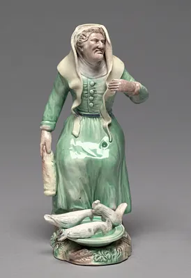 Old Woman Feeding Chickens