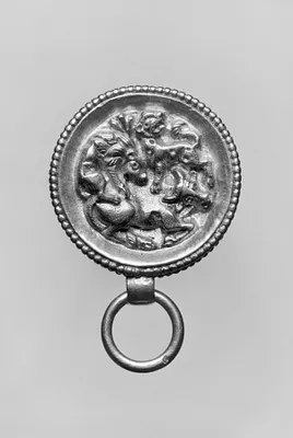 Pendant in the Form of a Round Box with Lions Attacking a Bull