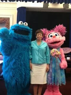 Valerie Jarrett with Sesame Street characters