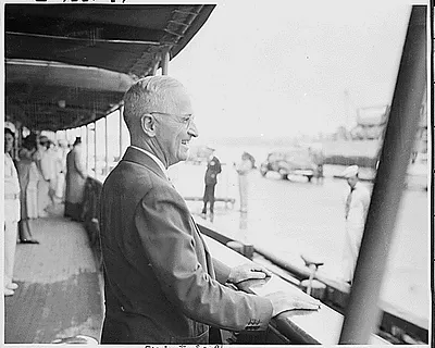 Photograph of President Truman on the deck of his yacht, the U.S.S. WILLIAMSBURG, preparing to depart Washington for a vacation cruise to Bermuda
