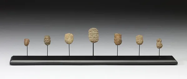 Human Head and Animal Effigy Beads