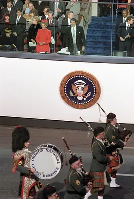 President Ronald Reagan and nancy Reagan at the Inaugural Parade in front of the viewing stands along Pennsylvania Avenue