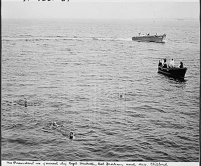 Photograph of President Truman swimming in the harbor at Cape Henlopen with other members of his party, including his Naval Aide, Captain James Foskett; his personal physician, Colonel Wallace Graham; and his Special Counsel, Clark Clifford; during his vacation cruise to Rhode Island and Bermuda