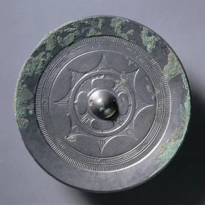 Mirror with Quatrefoil, Concentric Circles, and Linked Arcs