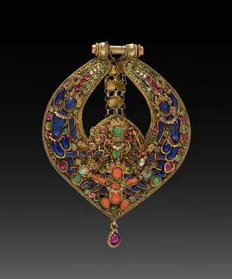 Deity Earring with Vishnu on Garuda (front) and chepu (monster mask) (back)