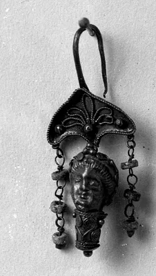 Earring with a woman's head