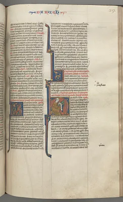 Fol. 317r, Baruch, historiated initial H, Baruch seated at a desk writing on a scroll