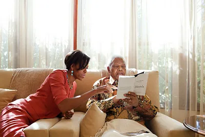 First Lady Michelle Obama and Nelson Mandela in conversation