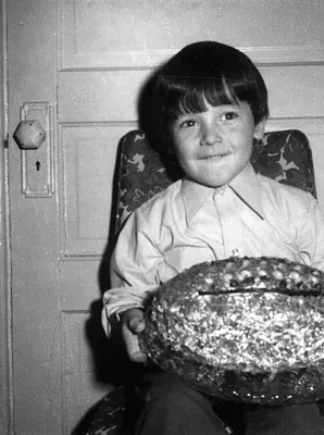 Young Boy Holding Foil-Wrapped Object, Cedar Falls, 1974