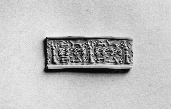 Cylinder Seal with a Standing Figure and Animals
