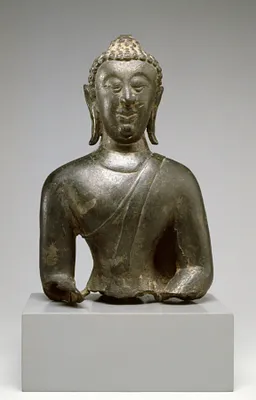 Head and Upper Body of a Seated Buddha in ""Maravijaya""