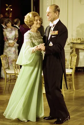 First Lady Betty Ford Dancing with Prince Philip of Great Britain in the State Dining Room during a State Dinner Honoring Queen Elizabeth II and Prince Philip