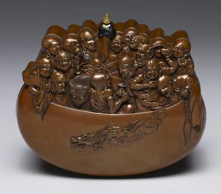 Box in the Shape of Sixteen Arhats in a Begging Bow